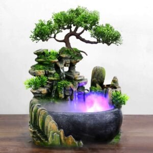 Desktopfontein met LED – Waterval en Kleurverandering – Ontspanningsfontein voor Thuis en Kantoor – Compacte BureaudecoratieCreëer een serene sfeer in elke ruimte met deze prachtige desktopfontein met LED-waterval. Laat je betoveren door het kalmerende geluid van stromend water terwijl de kleurveranderende LED-verlichting een magische ambiance toevoegt aan je kamer. Of je nu op zoek bent naar een rustgevend decoratief accent voor je bureau of een vredige toevoeging aan je rotstuin of terras, deze fontein voegt een vleugje rust en elegantie toe aan elke omgeving.  Voordelen:  Creëert een rustgevende sfeer met stromend water en kleurveranderende LED-verlichting. Compact formaat, perfect voor gebruik op bureaus, tafels of in kleine ruimtes. Kan worden gebruikt als luchtbevochtiger om de luchtvochtigheid in droge omgevingen te verbeteren. Kleurveranderende LED-verlichting  Geniet van een veelzijdige ambiance met de ingebouwde LED-verlichting die soepel van kleur verandert, waardoor een rustgevende en ontspannende sfeer ontstaat.  Watervalontwerp  Het elegante ontwerp bootst een natuurlijke waterval na, waardoor een vredig gevoel van rust en sereniteit wordt gecreëerd.  Luchtbevochtigingsfunctie  Naast het esthetische aspect dient deze fontein ook als luchtbevochtiger, waardoor de luchtvochtigheid wordt verhoogd om een comfortabelere omgeving te creëren, vooral in droge klimaten.  Compact en draagbaar  Met zijn compacte formaat past deze fontein perfect op elk bureau, tafelblad of zelfs in een kleine hoek, waardoor hij ideaal is voor zowel thuis als op kantoor.  Eenvoudig te gebruiken  Met een eenvoudige installatie en bediening is deze fontein gemakkelijk te gebruiken, zodat je snel kunt genieten van zijn rustgevende effecten.  Verpakkingsinhoud  1 desktopfontein 1 LED-verlichtingsunit 1 stroomadapter 1 gebruiksaanwijzing Productspecificaties  Afmetingen: 20 x 20 x 13 cm Materiaal: Kunststof Kleur: groente Voeding: Stroomadapter (meegeleverd) Haal nu deze prachtige desktopfontein in huis en creëer direct een rustgevende ambiance waar je ook bent! Bestel nu en geniet van de rustgevende voordelen van stromend water en kleurveranderende LED-verlichting.
