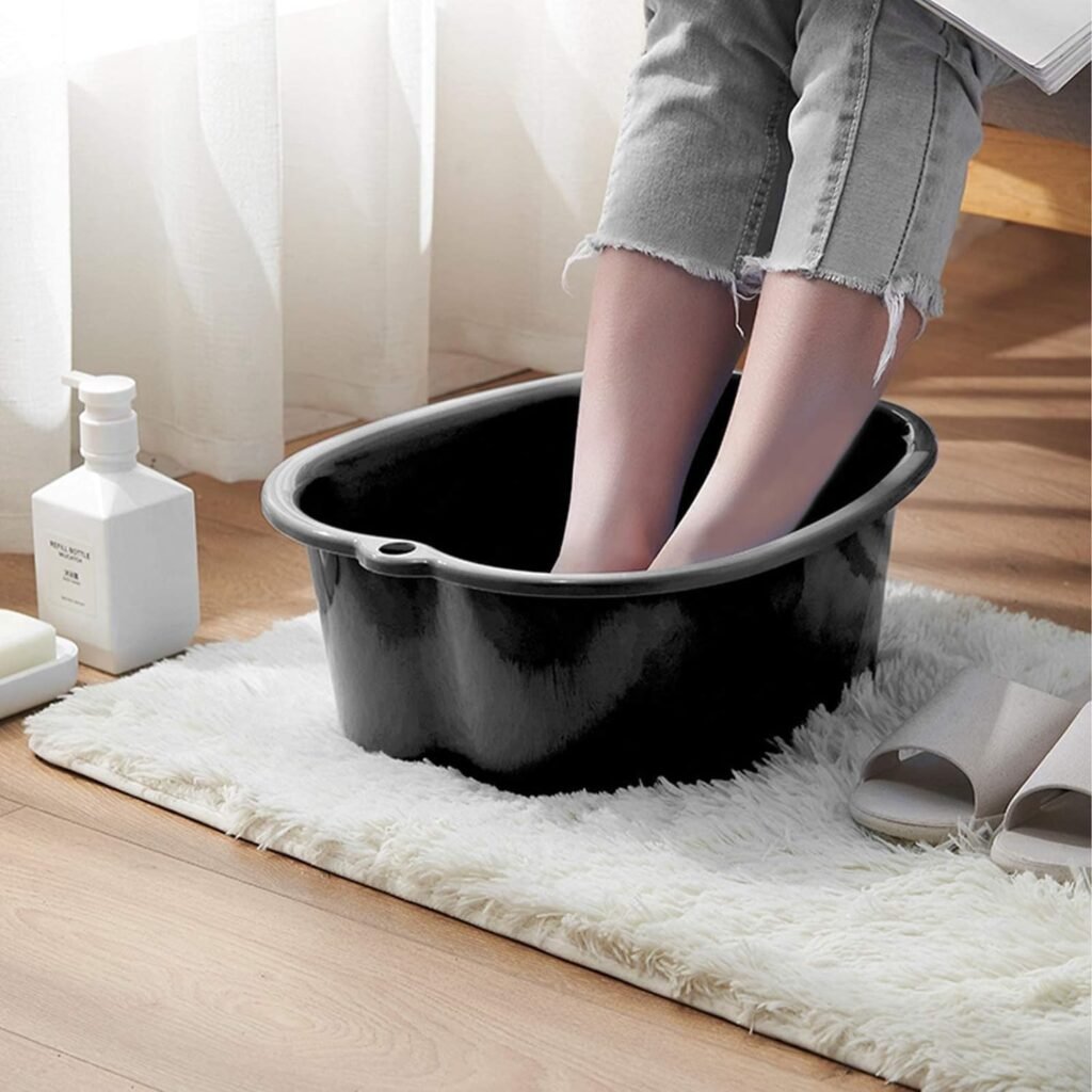 Groot zwart plastic voetbad voor voetverzorging, pedicure en voetmassage