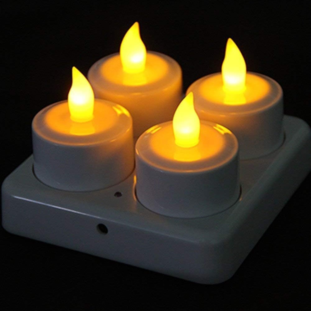 Set van 4 oplaadbare LED theelichtjes met flikkerend gele vlam en oplaadbasis voor sfeerverlichting